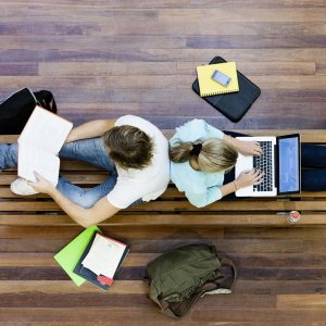 Top,View,Of,Male,And,Female,University,Students,Studying
